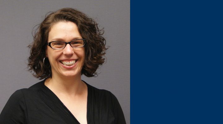 Kathleen Ryan Headshot with blue background