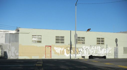 A block of Adeline Street near 53rd Street in Oakland is completely paved and has no trees or greenery.